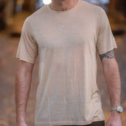 Man wearing a Silk Cashmere Merino T-Shirt with a blurred background