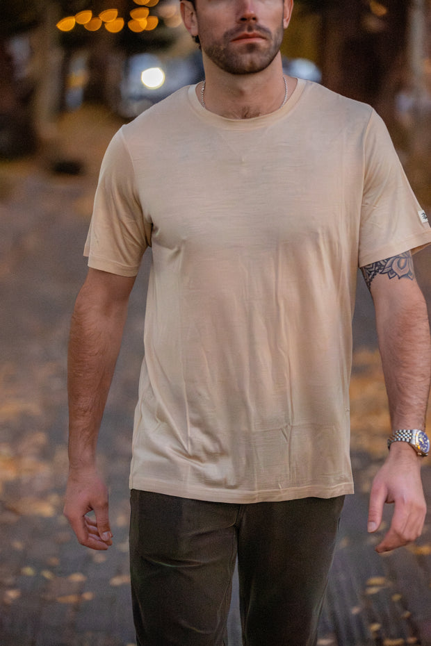 Man wearing a Silk Cashmere Merino T-Shirt with a blurred background