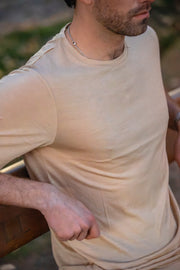 Man wearing a Silk Cashmere Merino T-Shirt with a blurred background